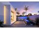 Charming courtyard with comfortable seating and stylish fountain feature, set against a modern home design at 1354 Westway Dr, Sarasota, FL 34236