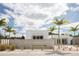 Contemporary home featuring concrete wall and xeriscaping in a sunny locale at 1354 Westway Dr, Sarasota, FL 34236