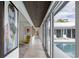 Bright hallway featuring modern art and sliding doors leading to the pool area at 1354 Westway Dr, Sarasota, FL 34236