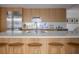 Modern kitchen with stainless steel appliances, breakfast bar, and wooden cabinetry at 1354 Westway Dr, Sarasota, FL 34236