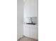 Contemporary laundry area featuring white cabinetry, sleek sink, and minimalist design at 1354 Westway Dr, Sarasota, FL 34236