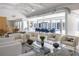 Bright, open-concept living room with modern decor, vaulted ceilings, and seamless flow to outdoor spaces at 1354 Westway Dr, Sarasota, FL 34236