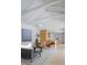 Bright living space with vaulted ceilings, sleek furniture, and an open layout connecting to the kitchen at 1354 Westway Dr, Sarasota, FL 34236
