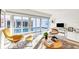 Sunlit living room with views of the pool and patio through sliding glass doors at 1354 Westway Dr, Sarasota, FL 34236