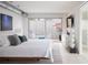 Comfortable bedroom with a plush rug, access to the patio, and modern decor at 1354 Westway Dr, Sarasota, FL 34236