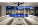 Stylish patio with comfortable white seating overlooking a serene pool, perfect for outdoor relaxation and entertaining at 1354 Westway Dr, Sarasota, FL 34236