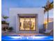 Modern home featuring a pool, outdoor seating and a stylish room with floor to ceiling shelving visible through the glass at 1354 Westway Dr, Sarasota, FL 34236
