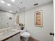 Bathroom featuring a modern vanity, toilet, and decorative accents, enhanced by tile flooring and recessed lighting at 1485 Gulf Of Mexico Dr # 205, Longboat Key, FL 34228