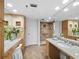 Bathroom with stone-look floor tiles, granite countertops, and large walk-in shower at 1485 Gulf Of Mexico Dr # 205, Longboat Key, FL 34228