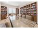 Well-stocked library with floor-to-ceiling bookshelves, offering a quiet space for reading and relaxation at 1485 Gulf Of Mexico Dr # 205, Longboat Key, FL 34228