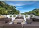 Cozy outdoor fireplace area with comfortable seating, ideal for entertaining and enjoying warm evenings at 1485 Gulf Of Mexico Dr # 205, Longboat Key, FL 34228