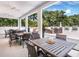 Outdoor patio with tables and chairs, perfect for al fresco dining and relaxing in a serene setting at 1485 Gulf Of Mexico Dr # 205, Longboat Key, FL 34228