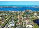 Stunning aerial view showcasing the waterfront property near the boat marina and beautiful coastline at 1610 S Lake Shore Dr, Sarasota, FL 34231