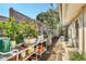 Lush backyard featuring a gardening area, a covered grill, and a stone paver path at 1610 S Lake Shore Dr, Sarasota, FL 34231