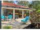 Outdoor patio featuring multiple seating areas and easy access to the home's interior at 1610 S Lake Shore Dr, Sarasota, FL 34231