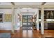 Charming foyer with wood floors, high ceilings, and views through to the exterior at 1610 S Lake Shore Dr, Sarasota, FL 34231