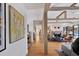 Open hallway featuring hardwood floors and views of the living room with vaulted ceilings at 1610 S Lake Shore Dr, Sarasota, FL 34231