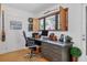 Bright, organized home office with hardwood floors and a gray desk near a window at 1610 S Lake Shore Dr, Sarasota, FL 34231