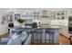Stylish kitchen with large island, stainless steel appliances, and breakfast bar seating at 1610 S Lake Shore Dr, Sarasota, FL 34231