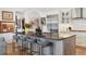 Beautiful kitchen with stainless steel appliances, large island, and breakfast bar seating at 1610 S Lake Shore Dr, Sarasota, FL 34231