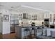Spacious white kitchen with stainless steel appliances, large island, and breakfast bar at 1610 S Lake Shore Dr, Sarasota, FL 34231