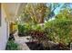 Lush landscaping featuring stone pavers and a variety of shrubs and plants at 1610 S Lake Shore Dr, Sarasota, FL 34231