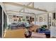 Open living room featuring hardwood floors, beamed ceilings, and gallery wall at 1610 S Lake Shore Dr, Sarasota, FL 34231