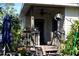 Charming front porch featuring a ceiling fan, hanging decorations, potted plants, and a cozy seating area at 1715 17Th W Ave, Bradenton, FL 34205