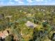 Gorgeous aerial view of a private home with pool nestled in a lush, green landscape at 201 Eaglenook Way, Osprey, FL 34229