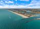 Beautiful aerial shot of a coast with white sand beaches meeting turquoise waters and blue sky at 201 Eaglenook Way, Osprey, FL 34229