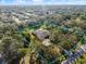 Beautiful aerial shot of a home with a private yard surrounded by beautiful trees at 201 Eaglenook Way, Osprey, FL 34229