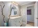 Updated bathroom featuring a single vanity and decorative accents at 201 Eaglenook Way, Osprey, FL 34229