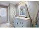 Updated bathroom featuring a single vanity and decorative accents at 201 Eaglenook Way, Osprey, FL 34229