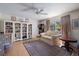 Bedroom with ceiling fan, window, and a light-filled interior at 201 Eaglenook Way, Osprey, FL 34229