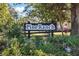 Pine Ranch community sign surrounded by trees and landscaping at 201 Eaglenook Way, Osprey, FL 34229