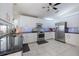 Modern kitchen with stainless steel appliances, granite countertops, subway tile and white cabinets at 201 Eaglenook Way, Osprey, FL 34229