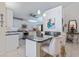 Spacious kitchen with stainless appliances, granite countertops, kitchen island with barstool seating at 201 Eaglenook Way, Osprey, FL 34229