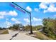 A view of the Legacy Trail, featuring a paved path, signage, and landscaping at 201 Eaglenook Way, Osprey, FL 34229