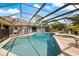Beautiful screened-in pool and spa area with spacious deck, perfect for outdoor entertaining at 201 Eaglenook Way, Osprey, FL 34229