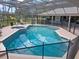 Inviting screened-in pool and spa area, perfect for relaxation at 201 Eaglenook Way, Osprey, FL 34229