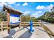 Community trail map with water fountain along paved Legacy Trail path at 201 Eaglenook Way, Osprey, FL 34229