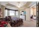 Cozy bedroom with a large window, ceiling fan, and en-suite bathroom entrance at 2123 Lynx Run, North Port, FL 34288