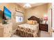 Bedroom featuring floral bedding, neutral walls, ceiling fan, and closet at 2123 Lynx Run, North Port, FL 34288
