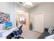 Comfortable bedroom with a sofa, desk, and archway leading to other living areas at 2123 Lynx Run, North Port, FL 34288