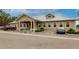 Front of community center with ample parking, landscaping, and well-maintained exterior at 2123 Lynx Run, North Port, FL 34288
