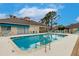 Inviting community pool with poolside seating offering a resort-style living experience at 2123 Lynx Run, North Port, FL 34288