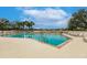 Enjoy this sparkling community pool with ample seating and beautiful views on a sunny day at 2123 Lynx Run, North Port, FL 34288