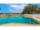 Enjoy sunny days at this community pool, complete with lounge chairs and a serene atmosphere at 2123 Lynx Run, North Port, FL 34288