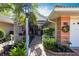 Delightful home exterior featuring a brick walkway, vibrant plants, and a charming facade at 2123 Lynx Run, North Port, FL 34288