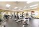 Bright gym featuring modern equipment like treadmills, elliptical machines and weight stations for residents' fitness needs at 2123 Lynx Run, North Port, FL 34288